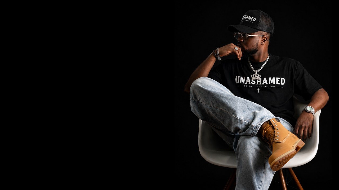 Model wearing the UNASHAMED tee