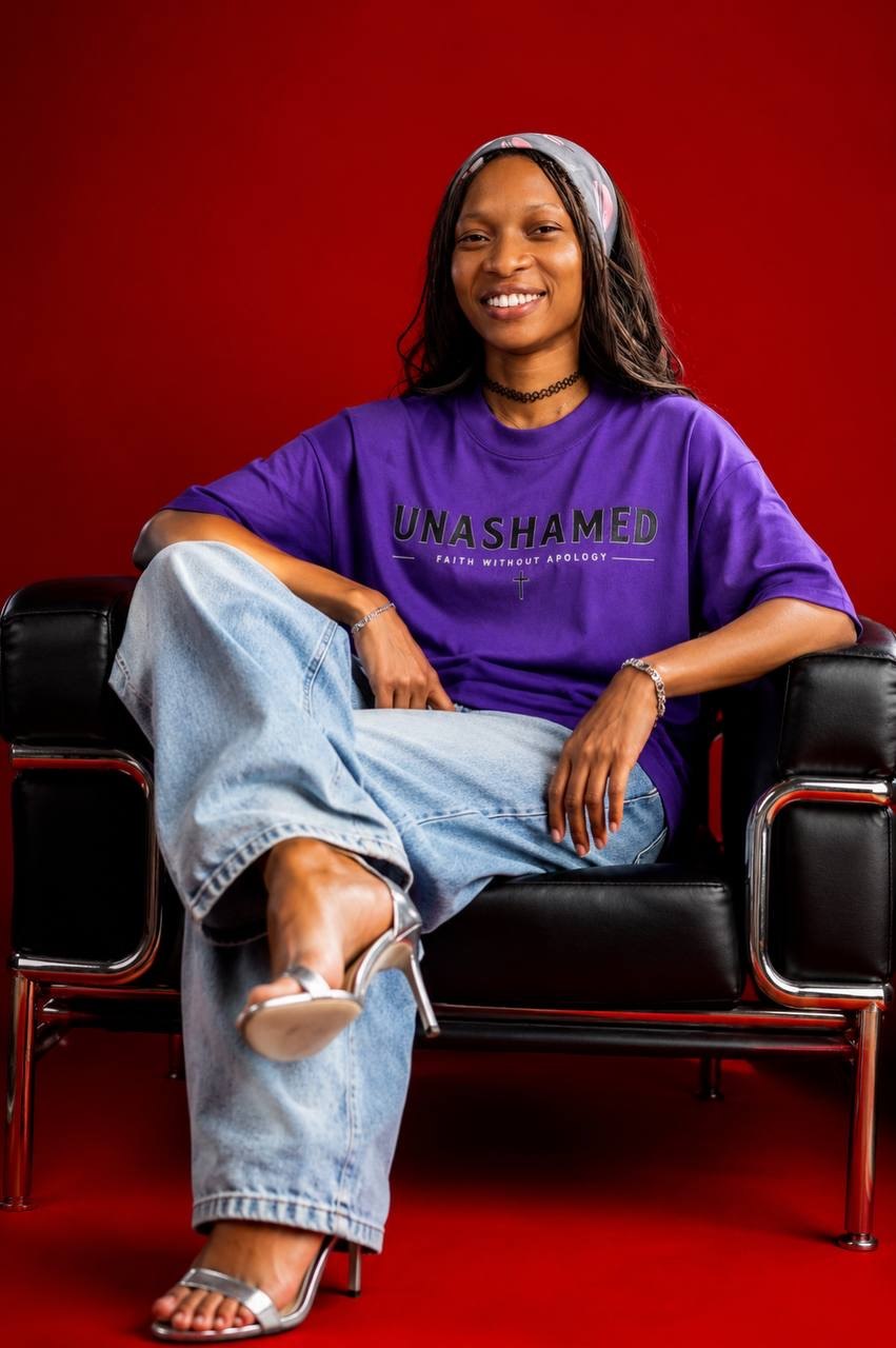 Customer in the purple UNASHAMED tee