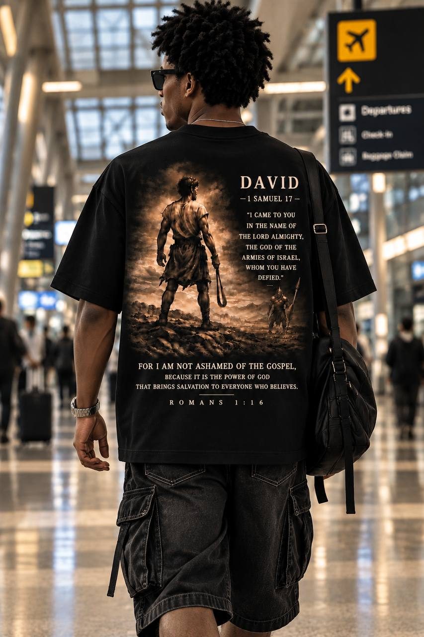 Back of the black David tee at the airport